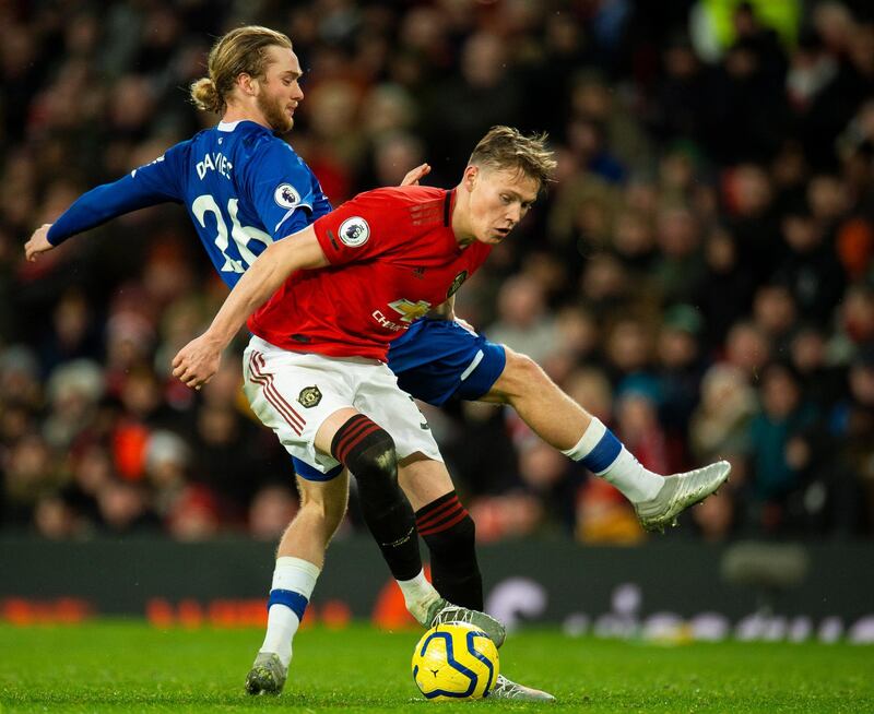 Everton's Tom Davies (L) in action with Manchester United's Scott McTominay. EPA