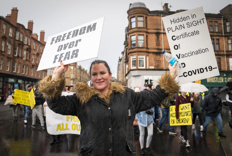 People take part in the so-called Freedom Rally, an anti-vaccine demonstration organised by campaign group Scotland Against Lockdown, in Glasgow city centre. PA