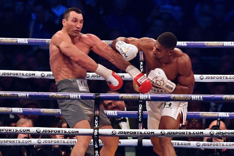 April 4, 2017: Joshua beat Wladimir Klitschko (UKR) by TKO in Round 11. Career-defining, epic fight for Joshua who knocked down Klitschko in the fifth round, only to hit the deck himself in the sixth but recovered to floor Ukrainian twice in 11th and claim the IBF, IBO and WBA world titles in front of 90,000 fans at Wembley Stadium. AFP