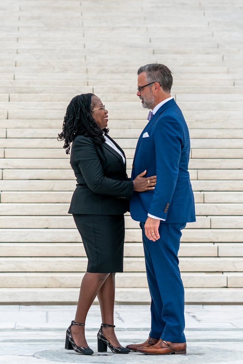 Ms Brown Jackson talks with her husband Dr Patrick Jackson outside the Supreme Court in Washington. EPA