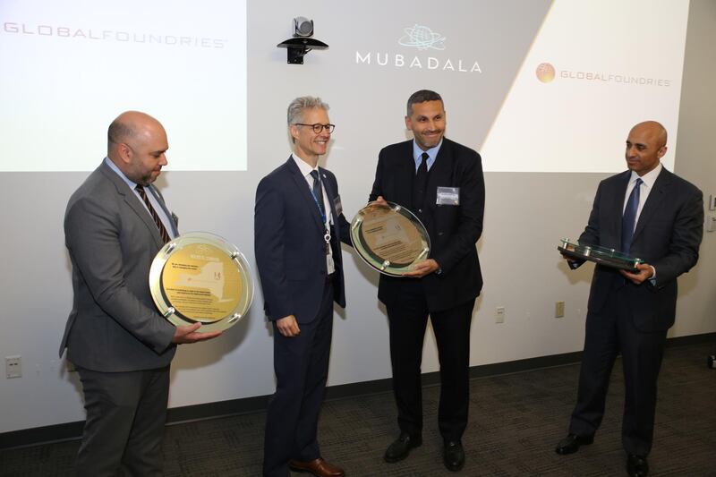 Khaldoon Al Mubarak, chief executive of Mubadala, (2nd from right) and UAE Ambassador to the US, Yousef Al Otaiba, receiving an award at GlobalFoundries in New York, USA. Courtesy GlobalFoundries