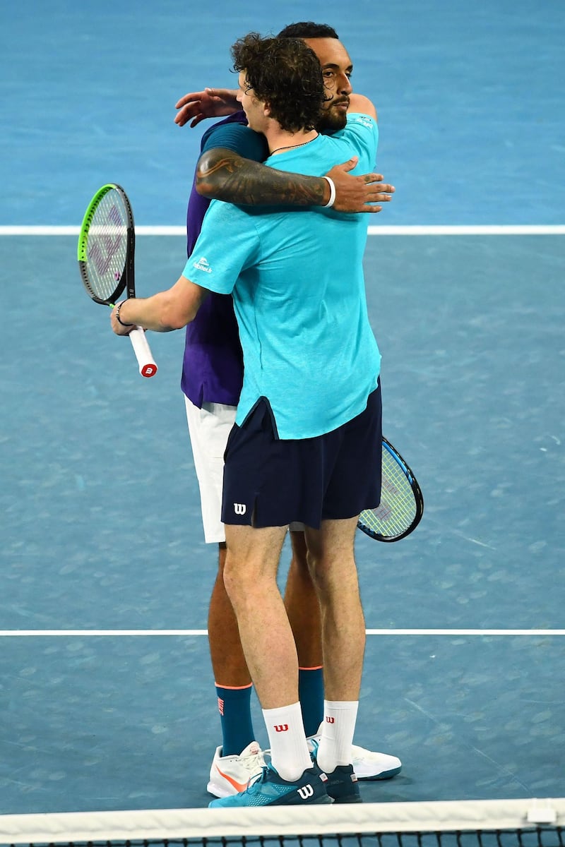 Nick Kyrgios hugs Ugo Humbert after their second round match at the Australian Open. AFP