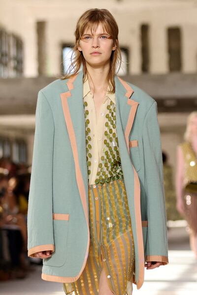A look that mixes sporty striping and sequins, from the Dries Van Noten spring/summer 2024 show. Reuters