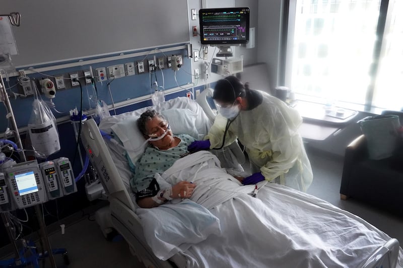 A respiratory therapist treats a Covid-19 patient in the ICU at Rush University Medial Centre in Chicago, Illinois. AFP