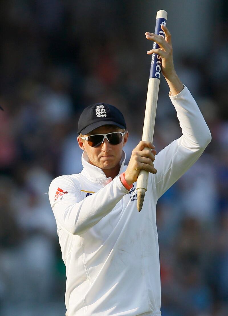England's Joe Root holds up a stump as England celebrate beating Australia by 347 runs at the end of day four of the second Ashes Test match held at Lord's cricket ground in London, Sunday, July 21, 2013. (AP Photo/Kirsty Wigglesworth) *** Local Caption ***  Britain Cricket England Australia .JPEG-06ab1.jpg