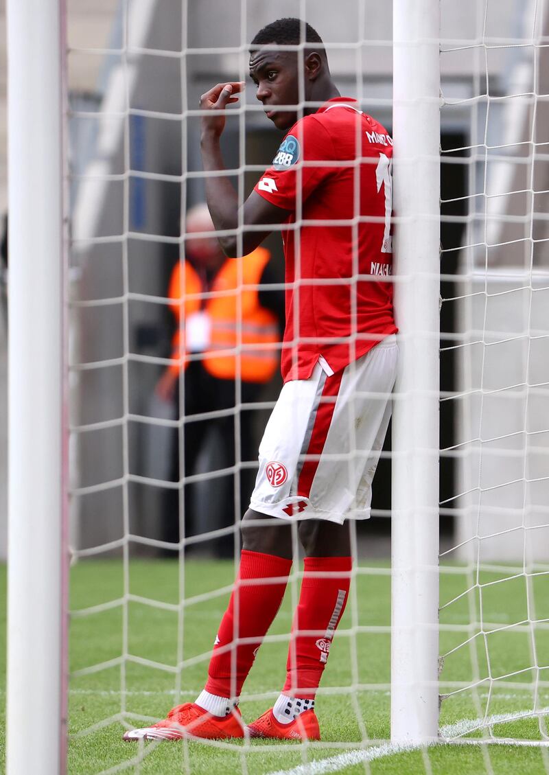 Mainz's Moussa Niakhate looks dejected after the match. Reuters