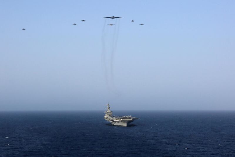 United States aircraft carrier Abraham Lincoln (CVN 72) and a U.S. Air Force B-52H Stratofortress, deployed to the region. US Navy via Reuters