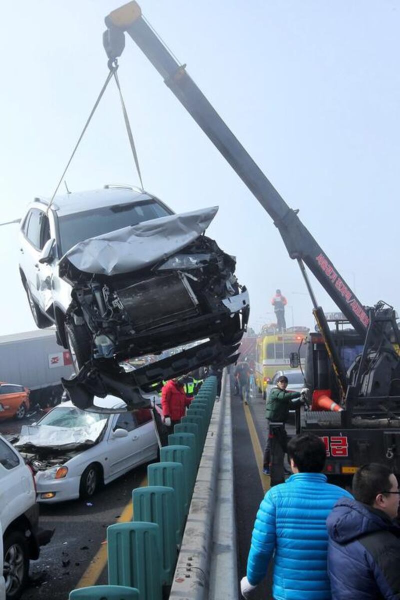 “I heard a series of bangs in front of me. Then I was rear-ended by a following car. I felt my car turning around and hitting a protection rail. I then lost consciousness,” cab driver Yoo Sang-Young told Yonhap news agency. James Park / EPA