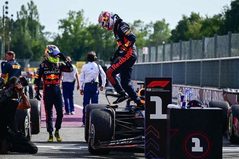 Red Bull's Max Verstappen jumps out of his car after his victory. AFP