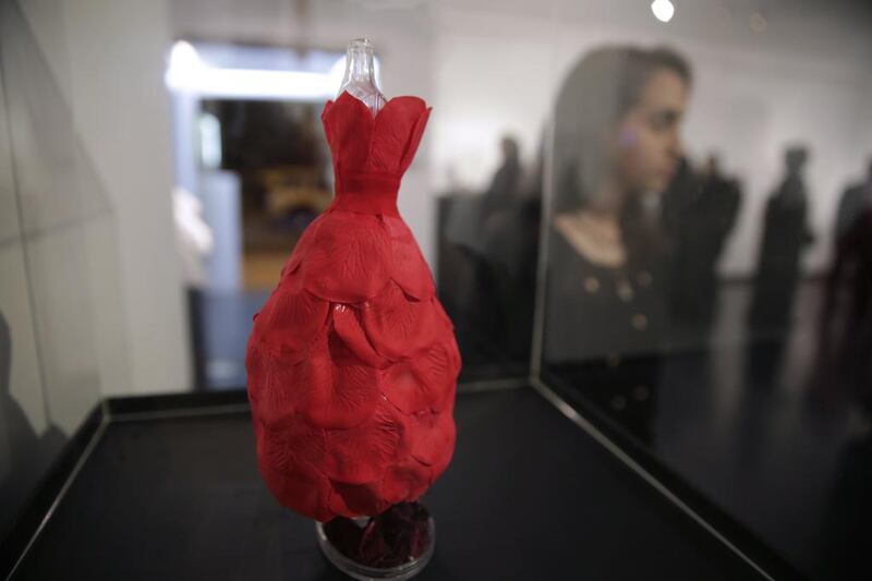‘La Rose Rouge’, a custom-designed miniature mannequin, by Dimah Shamma, 16, the youngest participating artist, stands on display.