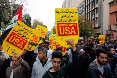 Iranians take part in an anti-US demonstration marking the 40th anniversary of the US embassy takeover. Abedin Taherkenareh / EPA
