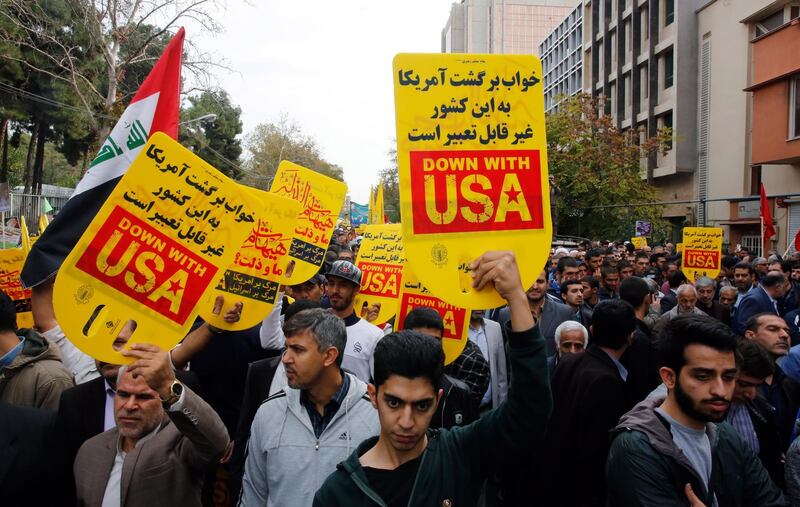 epa07971212 Iranians take part in an anti-US demonstration marking the 40th anniversary of US Embassy takeover, in front of the former US embassy in Tehran, Iran, 04 November 2019. According to media reports, thousands of protesters chanting 'Death to America' gathered at the former US embassy in Tehran to mark the 40th anniversary of the start of the Iran hostage crisis. Iranian students occupied the embassy on 04 November 1979 after the USA granted permission to the late Iranian Shah to be hospitalized in the United States. Over 50 US diplomats and guards were held hostage by students for 444 days. Iran and US tension over 2015 nuclear deal is going on.  EPA/ABEDIN TAHERKENAREH