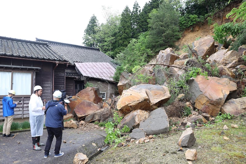 The Suzu earthquake causes landslides, tossing huge boulders onto homes and public roads. AFP