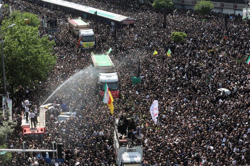 Tens of thousands of mourners attend the funeral ceremony for Mr Raisi in the capital. Reuters