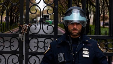 A police officer stands by the entrance to Columbia University in New York City, where protests are being staged. Getty Images