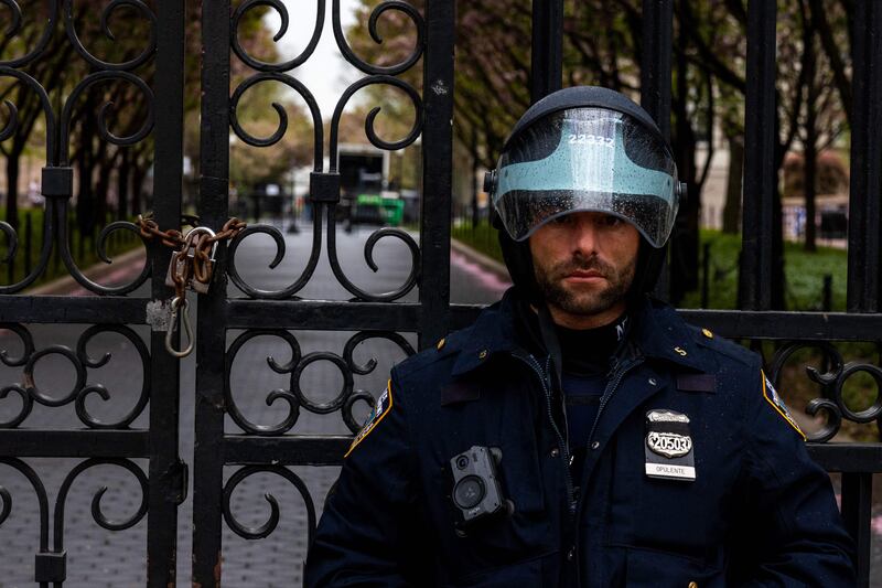 A police officer stands by the entrance to Columbia University in New York City, where protests are being staged. Getty Images