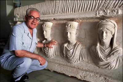 SYRIA - SEPTEMBER 01:  Palmyra's Last Treasures in Syria in September, 2002 - Khaled al-Asaad, the Director of Antiquities and Museum in Palmyra, in front of a rare sarcophagus depicting two priests (they wear the typical cylindrical cap), a father and his son, one with his wife and the other one with his sister. Dating from the 1st century, it is one of the finest sculptures in Palmyra.  (Photo by Marc DEVILLE/Gamma-Rapho via Getty Images)