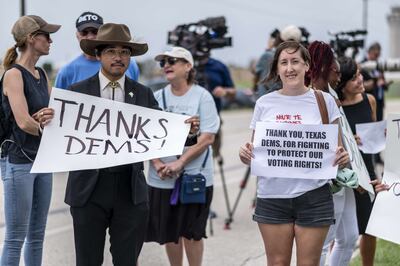 Supporters for Texas Democrats stand outside the Austin Bergstrom International Airport on July 12, 2021 in Austin, Texas. AFP