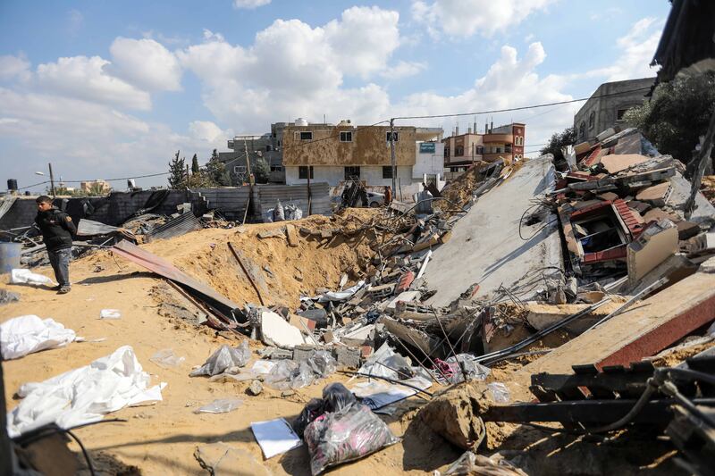 People inspect the damage to their homes after Israeli air strikes on Rafah. Getty