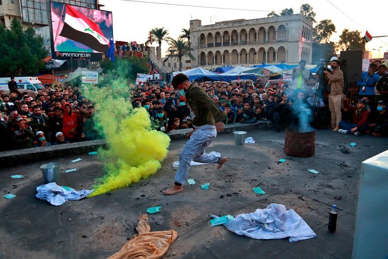 An Iraqi actor performs during a play titled "The revolution" during anti-government protests at Tahrir Square in Baghdad. AP