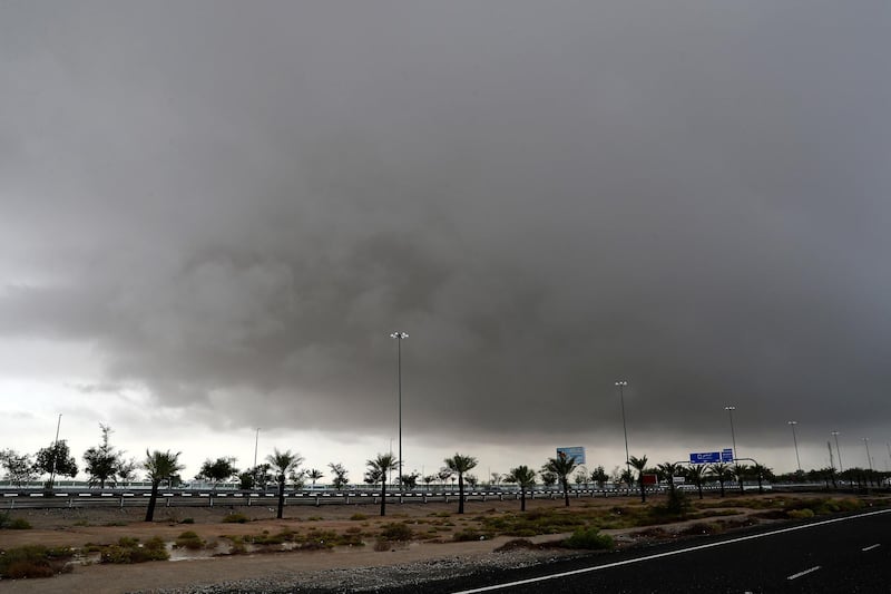 ABU DHABI , UNITED ARAB EMIRATES , Nov 20 – 2019 :- Dark rain clouds over the Ghantoot area in Abu Dhabi. ( Pawan Singh / The National )  For News