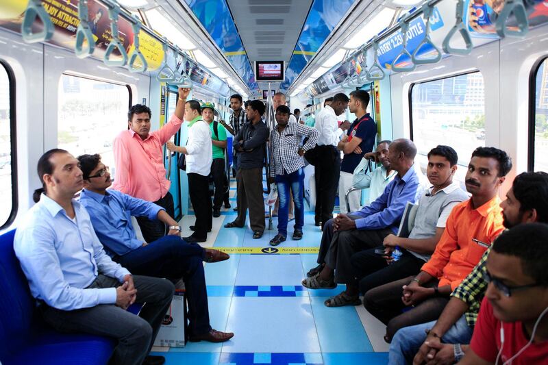 DUBAI, UAE. September 2, 2014 - Commuters ride the Dubai Metro towards Jebel Ali in Dubai, September 2, 2014. (Photos by: Sarah Dea/The National, Story by: STANDALONE STOCK, News)
