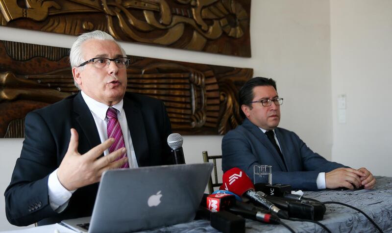 epa07105033 Spanish judge Baltasar Garzon (L) and lawyer Carlos Poveda (R) hold a press conference in Quito, Ecuador, 19 October 2018. Garzon filed a legal protection action in favor of the founder of Wikileaks, Julian Assange, before Ecuador could demand a new isolation conditions.  EPA/JOS JACOME