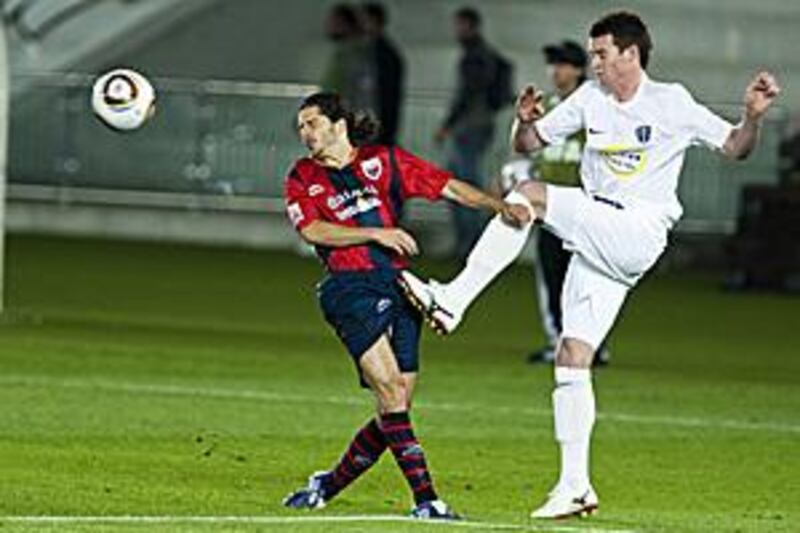 Atlante's Guillermo Rojas, left, dodges the ball in the first half against Auckland City.