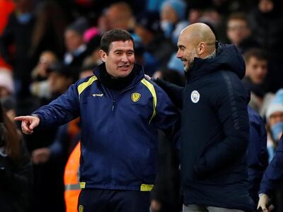 Soccer Football - Carabao Cup Semi Final First Leg - Manchester City v Burton Albion - Etihad Stadium, Manchester, Britain - January 9, 2019  Manchester City manager Pep Guardiola and Burton Albion coach Nigel Clough after the match                     Action Images via Reuters/Jason Cairnduff  EDITORIAL USE ONLY. No use with unauthorized audio, video, data, fixture lists, club/league logos or "live" services. Online in-match use limited to 75 images, no video emulation. No use in betting, games or single club/league/player publications.  Please contact your account representative for further details.