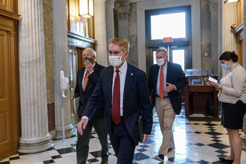 From left, Sen. Roger Wicker, Sen. James Lankford, and Sen. Richard Burr, arrive for votes during a rare weekend session to advance the confirmation of Judge Amy Coney Barrett to the Supreme Court, at the Capitol in Washington. AP Photo