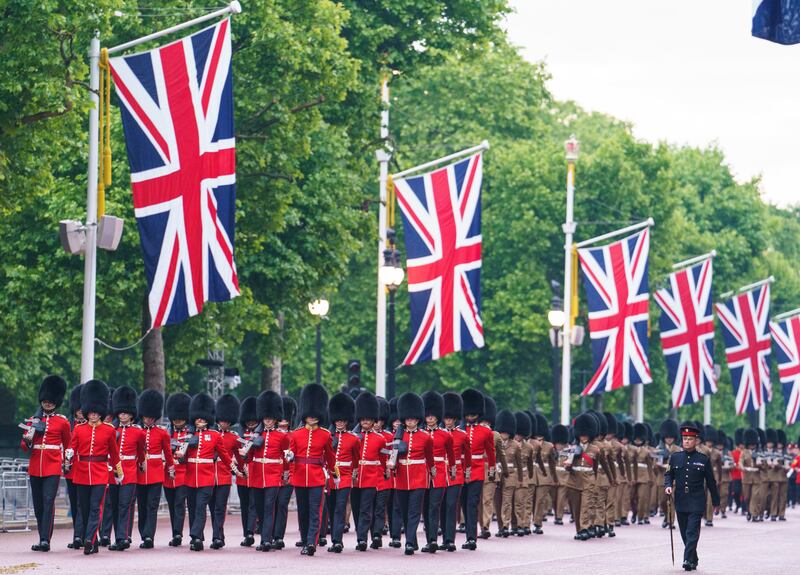 Troops march on The Mall. PA