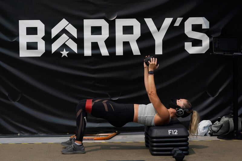 Instructor Georgia Fitzgerald gives a demonstration of an exercise at a Barry's Outdoors workout in San Francisco, California, USA. AP Photo