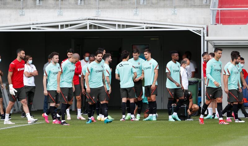 Portugal players including Cristiano Ronaldo, Rui Patricio, Ruben Dias and Pepe arrive for training at Illovszky Rudolf Stadium. Reuters