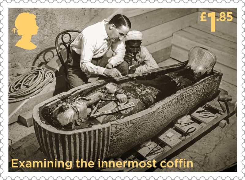 One of the stamps features British Egyptologist Howard Carter examining the golden sarcophagus of Tutankhamun