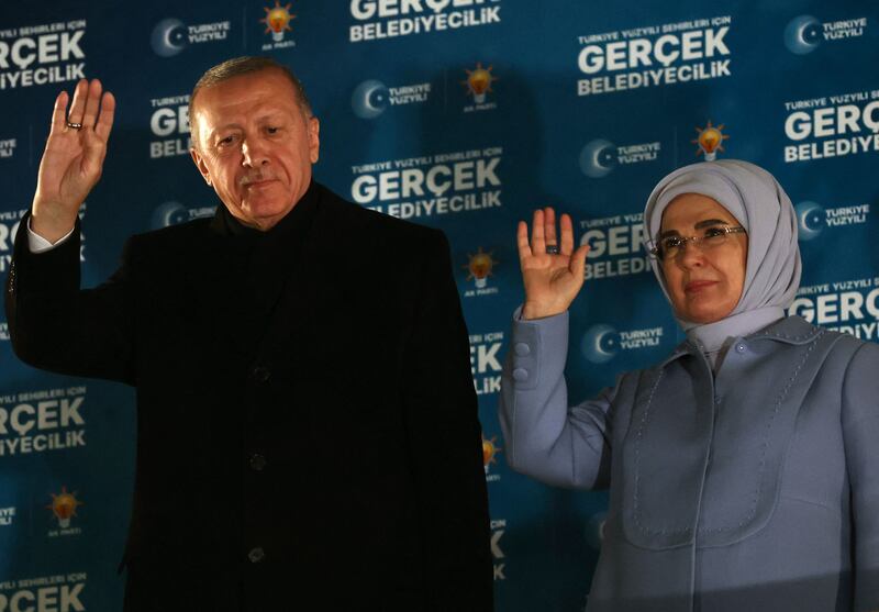 Turkish President and leader of Justice and Development Party Recep Tayyip Erdogan with his wife Emine Erdogan after the local elections in Ankara. AFP