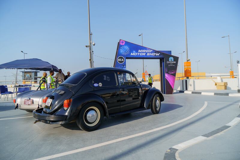 A 1970s Volkswagen Beetle in classic black.