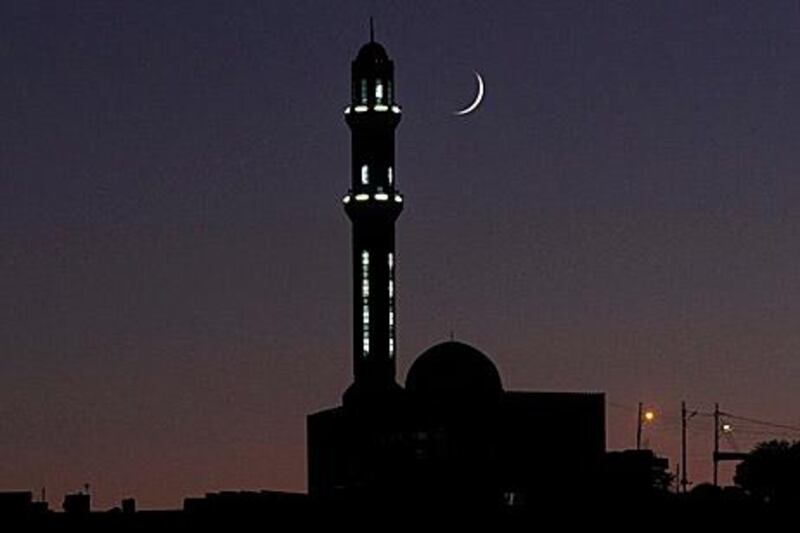 epa03313814 The crescent moon is seen above a minaret of a Jordanian mosques at sunset in Amman, Jordan, 21 July 2012, on the second day of the holy month of Ramadan. Ramadan is the ninth month of the Islamic calendar, during which Muslims across the world abstain from eating, drinking, smoking and sex from dawn to dusk.  EPA/JAMAL NASRALLAH