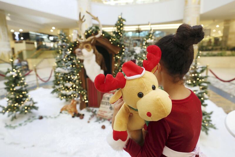 Dubai, United Arab Emirates - December 21st, 2017: Visitors at the Christmas lights at Wafi Mall. Thursday, December 21st, 2017 at Wafi Mall, Dubai. Chris Whiteoak / The National