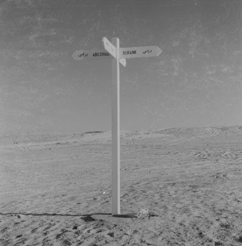 Archival photograph of the Trucial States shot by photographer Guy Gravett in 1962. Before roads, this signpost told desert travellers the way. one points to Abu Dhabi, the other to Buriami. The other signs point to Tarif, in the Western region and, to Dubai

Eds note** Karen *** Permission needed before use. Contact Crispin Gravett Cpgravett@aol.com. $150 one print use and 5 years online. 