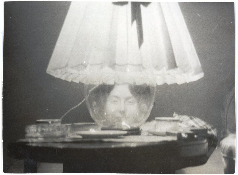 A portrait of Gulperie Eflatoun in a lamp base, Georges Henein, Cairo, Egypt, 1945, gelatin silver developing-out paper print. Gulperie Eflatoun Collection, courtesy of the Arab Image Foundation