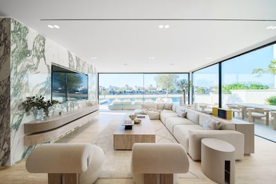 The living area is done up with travertine and arebescato marble. Photo: haus & haus
