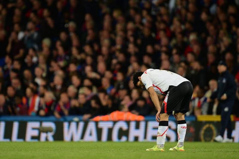 A dejected Luis Suarez of Liverpool reacts following his team's 3-3 draw during the Premier League match against Crystal Palace at Selhurst Park on May 5, 2014. Jamie McDonald/Getty Images