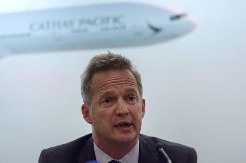 (FILES) This file photo taken on August 16, 2017 shows Cathay Pacific's chief executive officer Rupert Hogg speaking during a press conference on the company's half-year results in Hong Kong. Cathay Pacific announced the shock resignation on August 16, 2019 of its CEO Rupert Hogg after the Hong Kong carrier was castigated by Beijing because some of its staff had supported or joined recent protests in the city. / AFP / Anthony WALLACE
