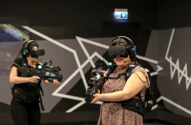 Players have fun at the virtual reality entertainment venue, Zero Latency at Abu Dhabi's Galleria Mall. Khushnum Bhandari / The National

