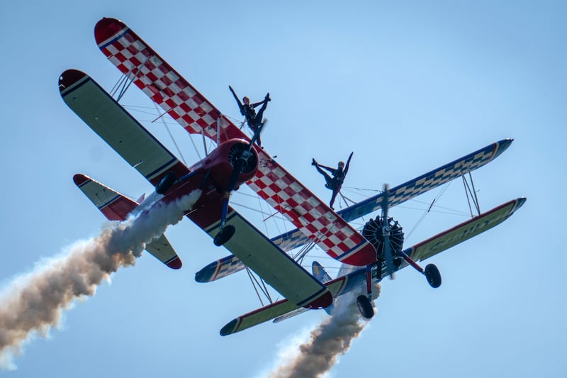 Wingwalkers from the AeroSuperBatics display team in action at the Midlands Air Festival in Alcester, central England. Getty