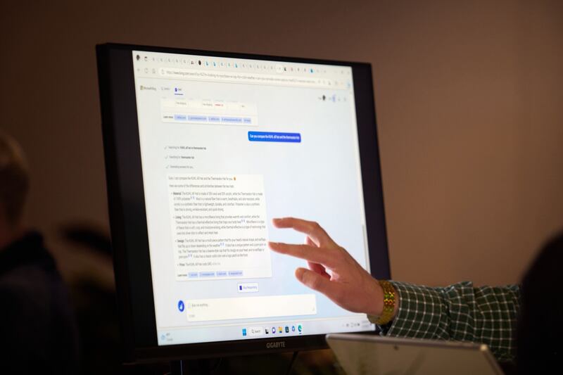 An attendee interacts with the AI-powered Microsoft Bing search engine. The company said it will limit chat sessions on the search engine to five questions per session and 50 questions per day. Bloomberg