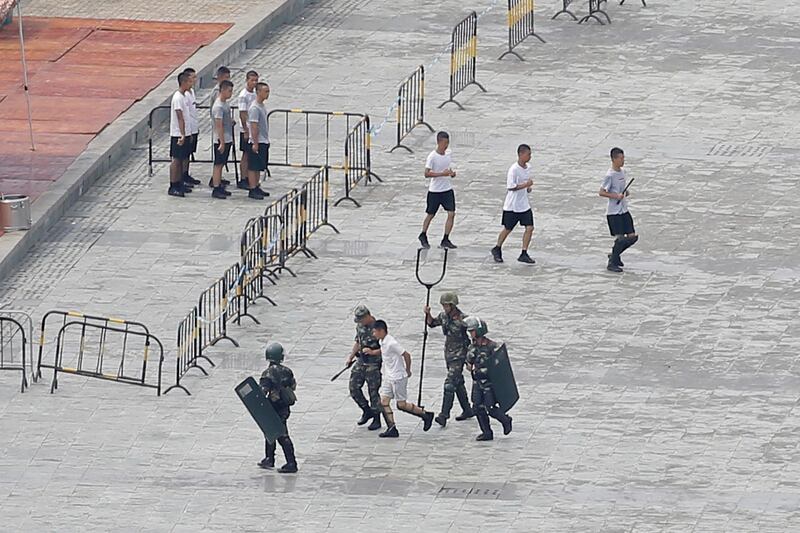 Chinese servicemen attend a crowd control exercise. Reuters