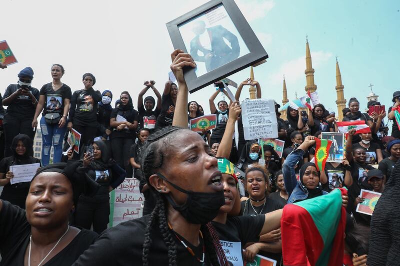 Members of the Oromo Ethiopian community in Lebanon take part in a demonstration to protest the death of musician and activist Hachalu Hundessa, in the capital Beirut on July 5, 2020. - Hundessa was shot and killed in the Ethiopian capital Addis Ababa on June 29, 2020. His death has sparked ongoing protests around the world. (Photo by ANWAR AMRO / AFP)