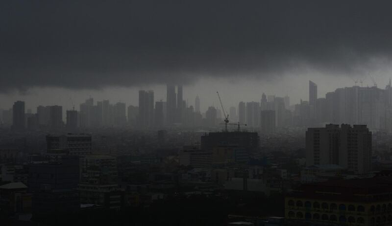 Rain clouds covers the skyline in Manila. AFP