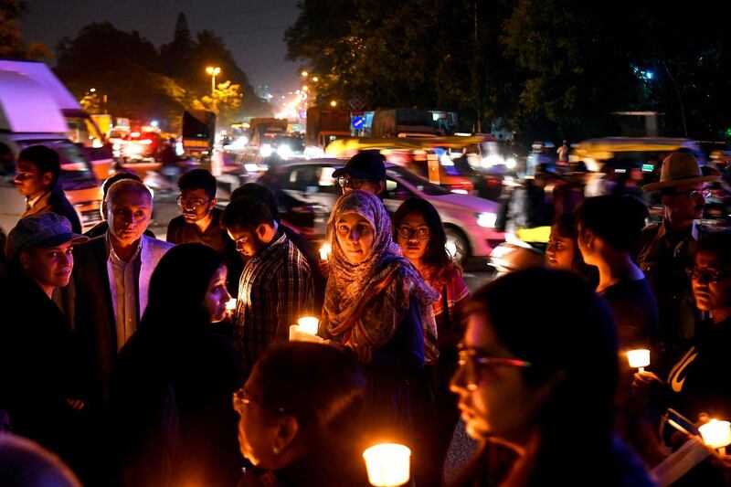 People hold a candlelight vigil in support of sexual assault victims and against the alleged rape and murder of a 27-year-old veterinary doctor in Hyderabad, in Bangalore. AFP